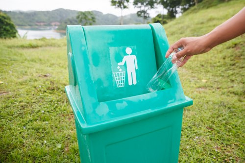 Workers sorting commercial recyclables into separate streams at a depot